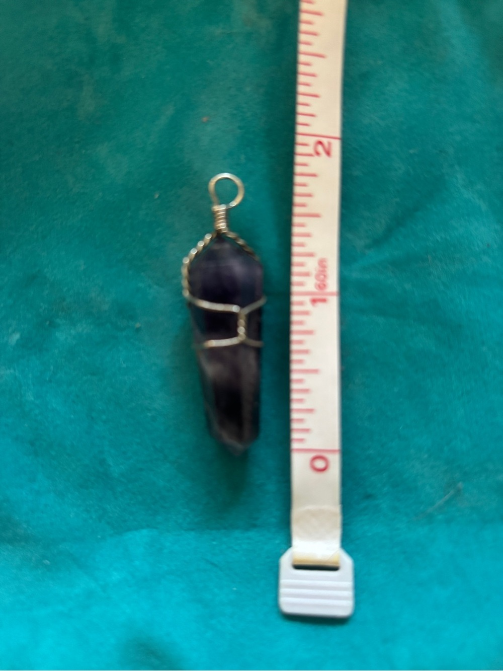 Amethyst pendant wrapped in sterling silver wire.